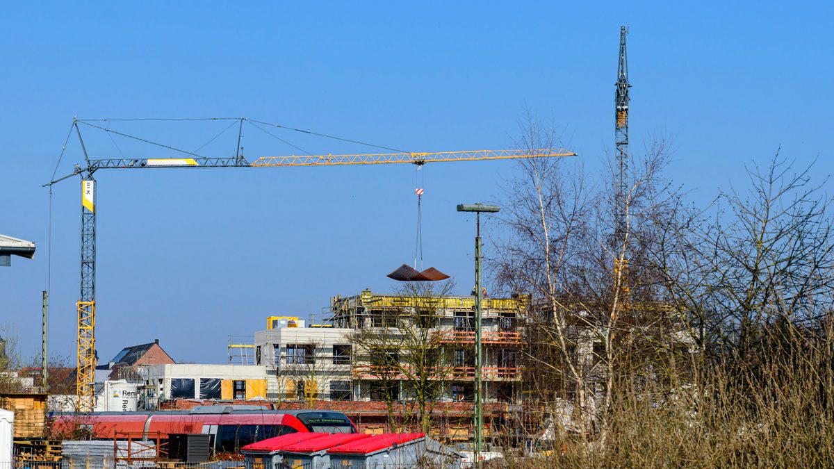 Building construction site with cranes and structures under development